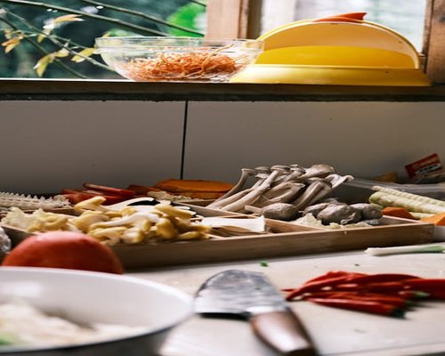 A variety of fresh local ingredients neatly organized on a kitchen counter