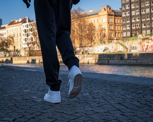 Comfortable walking shoes on a calm city sidewalk